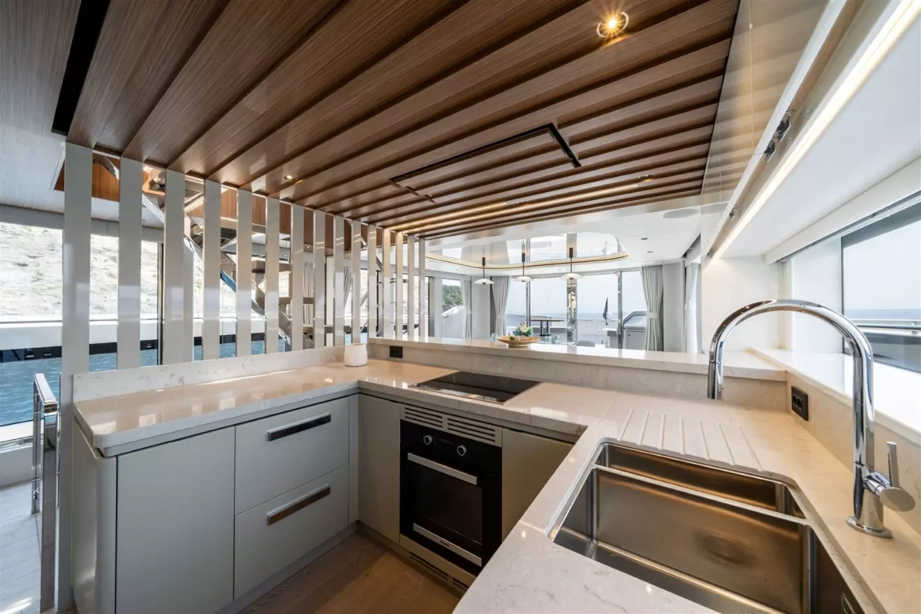 Centrally located modern galley and stairs layout on the Sunseeker Ocean 82 yacht