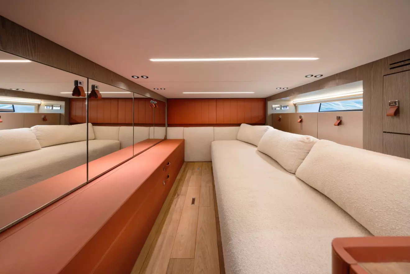 Convertible aft sofa bed with leather-paneled cabinet in SACS Hyper 5S interior