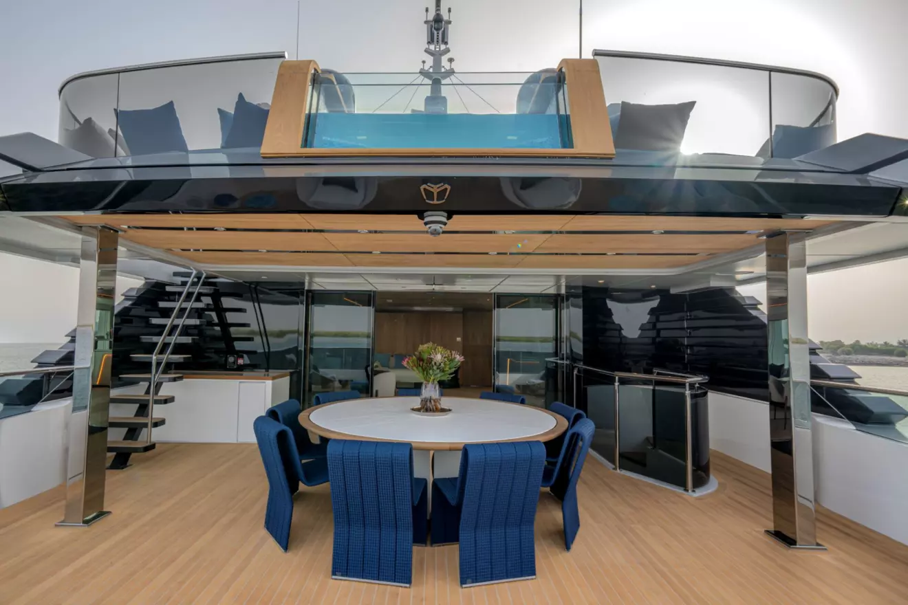 Upper deck outdoor dining area on Majesty 145