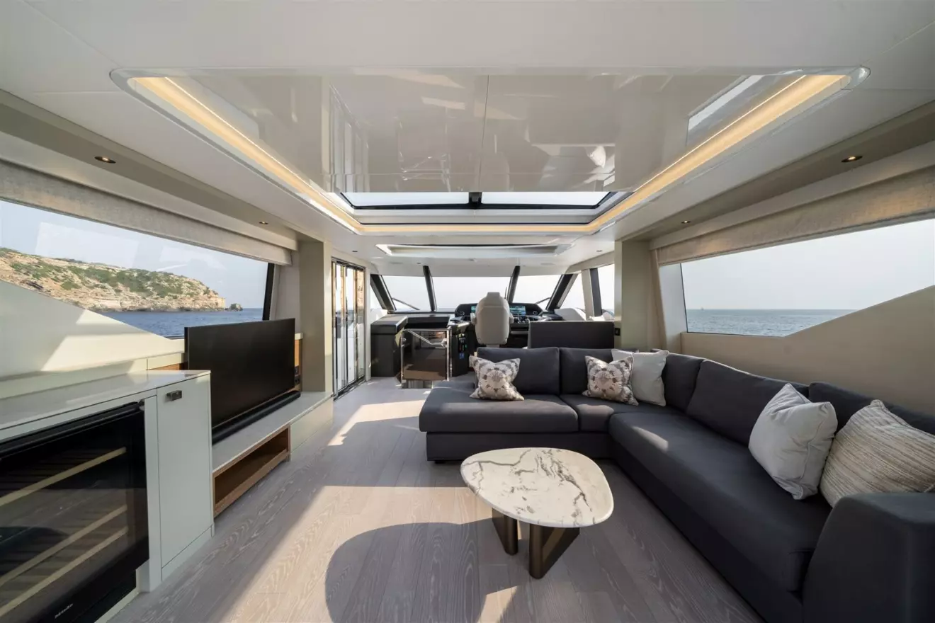 Interior view of the Sunseeker Ocean 82 enclosed flybridge sky lounge with luxury seating and panoramic windows