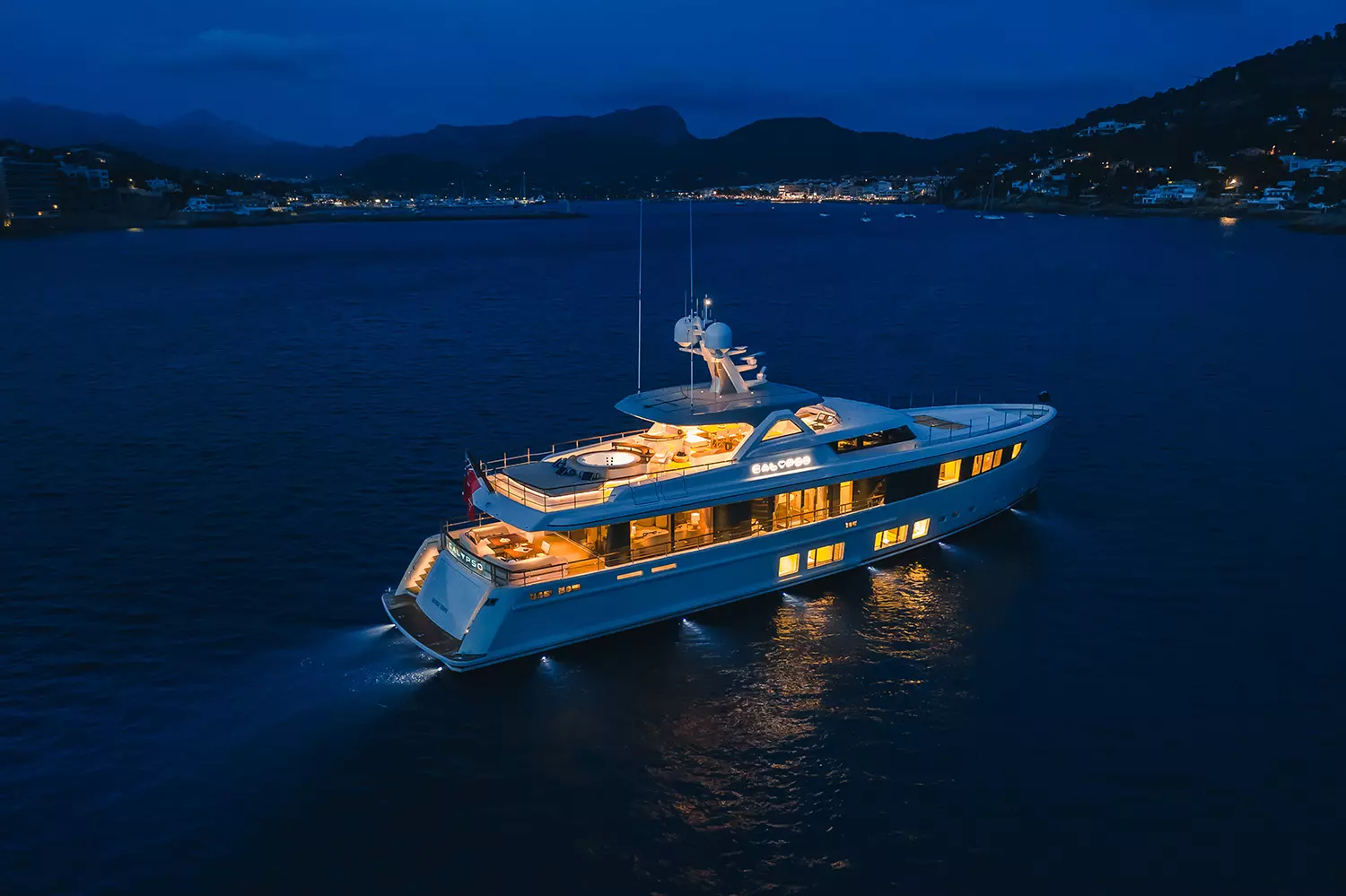 17_CALYPSO_night_aerial_glowing_yacht.jpg