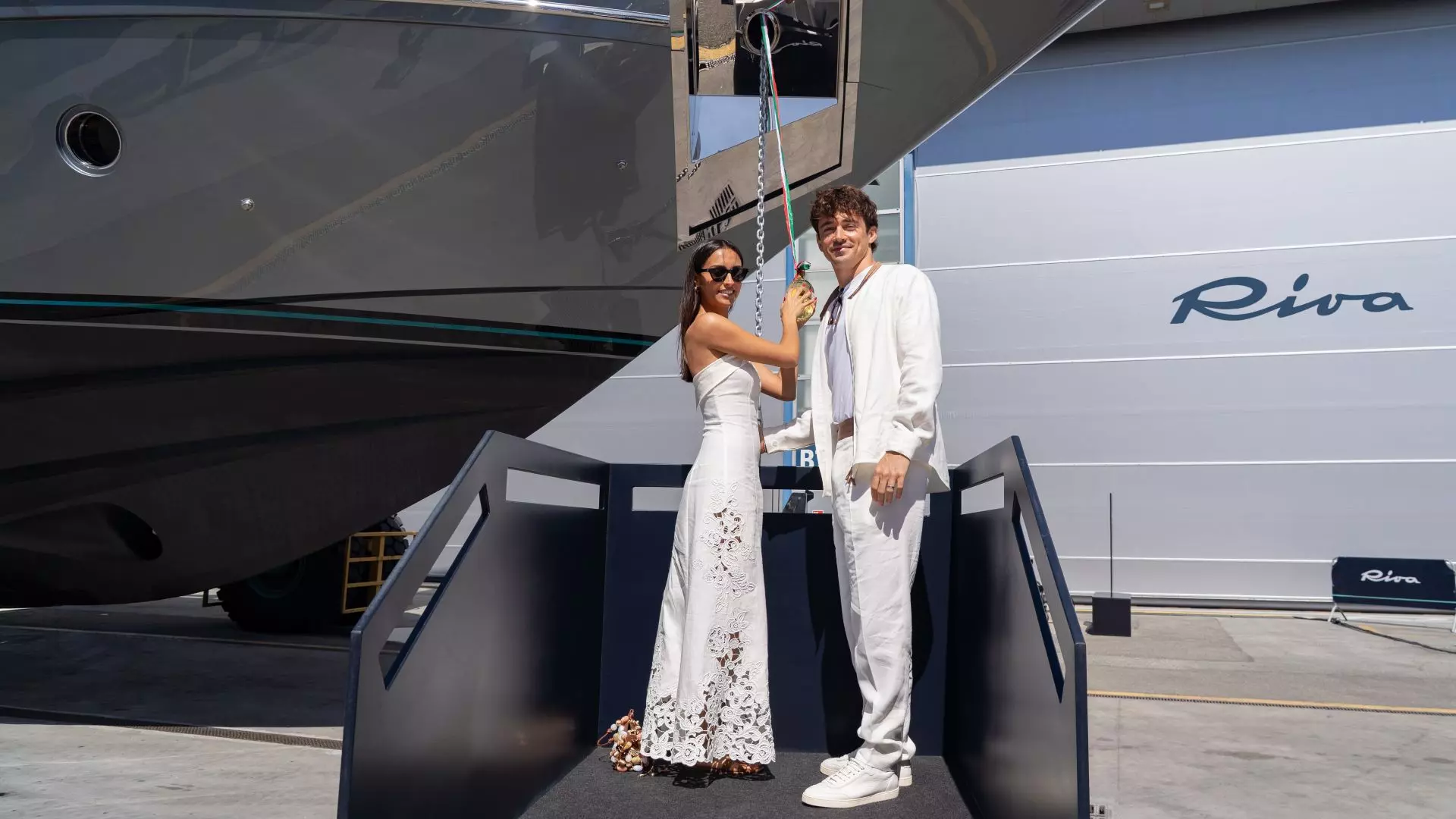 Charles Leclerc and his girlfriend in front of his new custom Riva 102’ Corsaro Super