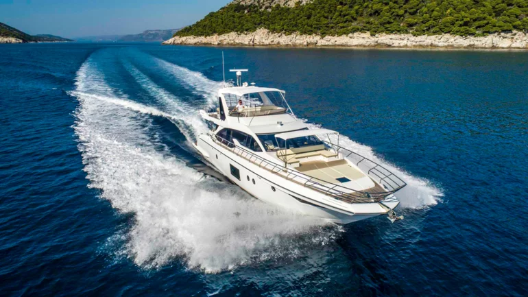 Luxury yacht running across the sea