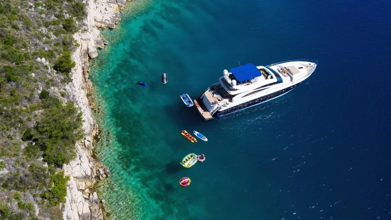 Water toys by luxury yacht in sea